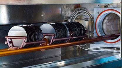 Silicon wafers on a horizontal batch reactor in a high-tech lab