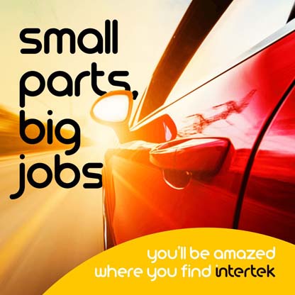 View from shiny red car driving into the sun